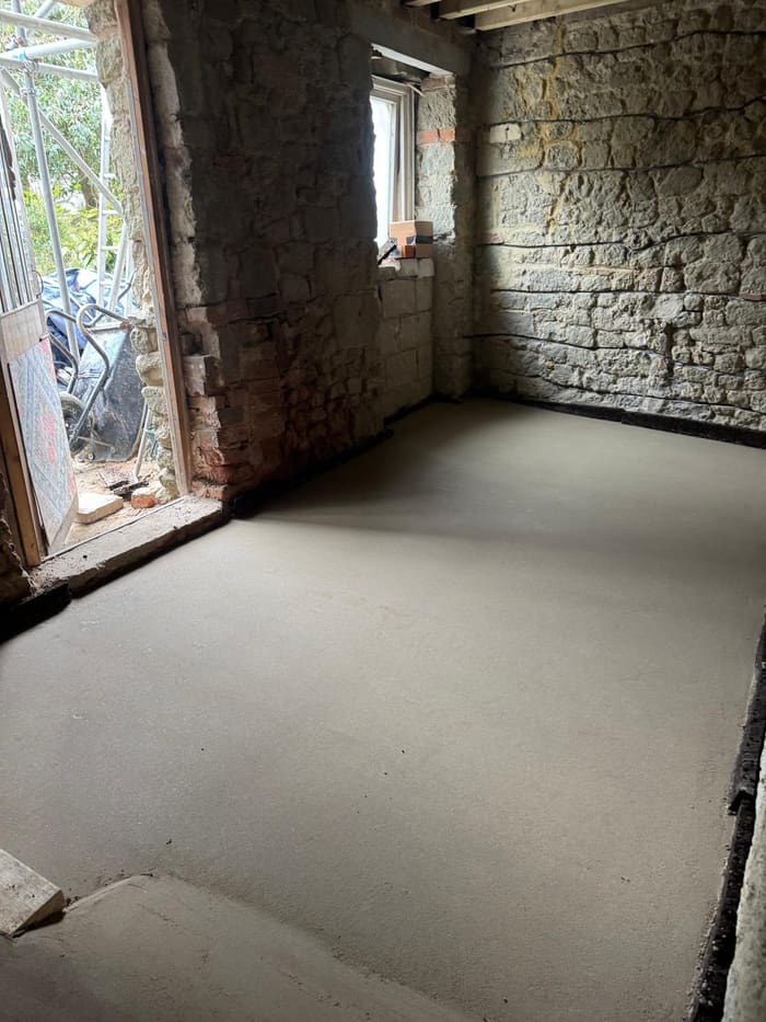 Finished breathable limecrete floor in a period stone cottage